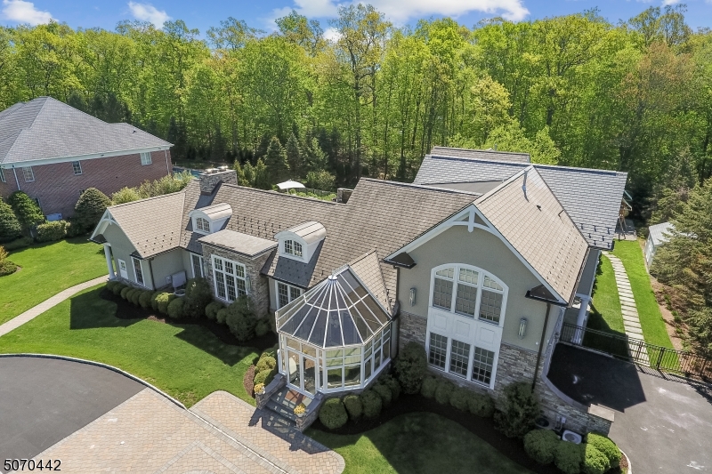 Spectacular California inspired Custom Home in highly coveted Chestnut Hill. This unique 5 bdrm, 5.3 bath residence offers the finest quality in every way imaginable.  Open floor plan w/ high ceilings & walls of retractable glass doors provides indoor/outdoor entertaining with ease.  Great Rm/Dining Rm w/ gas fp open to large patio w/ outdoor kitchen & saltwater pool/spa with fabulous yard and access to a luxe cabana.  Superior sound system inside & out.  Incredible primary suite w/ office, 2 walk-in custom fitted closets & office.  Amazing lower level featuring separate guest suite, state of the art home theater & concession area, extraordinary wine/dining rm and gym.  Too many features to mention.  Situated in a supremely private cul-de-sac setting.  Rare opportunity to enjoy resort style living year round.