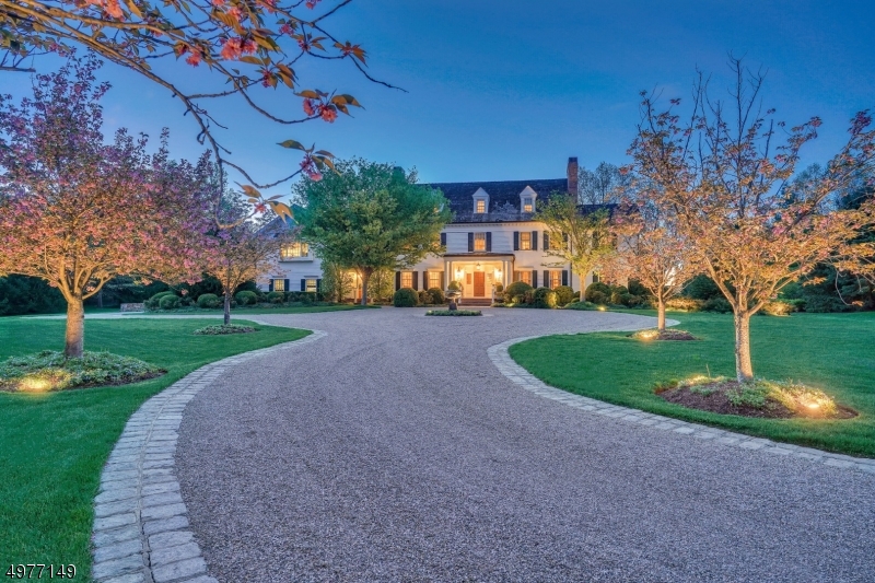 Sophisticated design. Impeccable craftsmanship. Like couture, nothing is more comfortable than the luxury of a bespoke home. Constructed to exacting standards and finished beyond reproach, this modern custom colonial is a masterful blend of formal and casual living. Towering ceilings, striking millwork, grand entry foyer with sweeping staircase, gourmet kitchen, sunroom, fireside limed oak library, fireside master suite with sitting room and luxurious bath retreat, four other expansive second floor bedrooms and finished attic with bedroom, full bath and leisure room are de rigueur. The unexpected includes a top-tier media room, wine cellar, tasting room, full bar, craft room, enormous gym and dual laundry centers. Presiding over a lush expansive property bordering preserved land, this home will not disappoint.