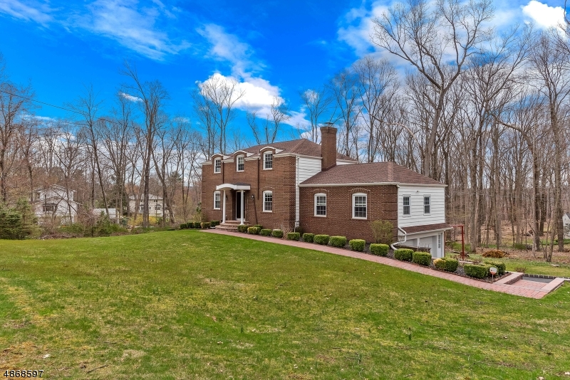 THIS MAGNIFICENT CENTER HALL COLONIAL IS SITUATED ON A CUL-DE-SAC.  HOME FEATURES WARDWOOD FLOORS THROGHOUT, BRICK FRONT, ,WOOD  BURNING FIRE PLACE IN FAMILY ROOM, SPACIOUS BASEMENT,   LARGE DECK, UNDERGROUND LAWN  SPRINKLER SYSTEM. THE  BACKYARD, BACKS TO WOODS.  CONVNIENTLY SITUATED TO SHOPPING, HIGHWAYS AND NYC TRANSIT.