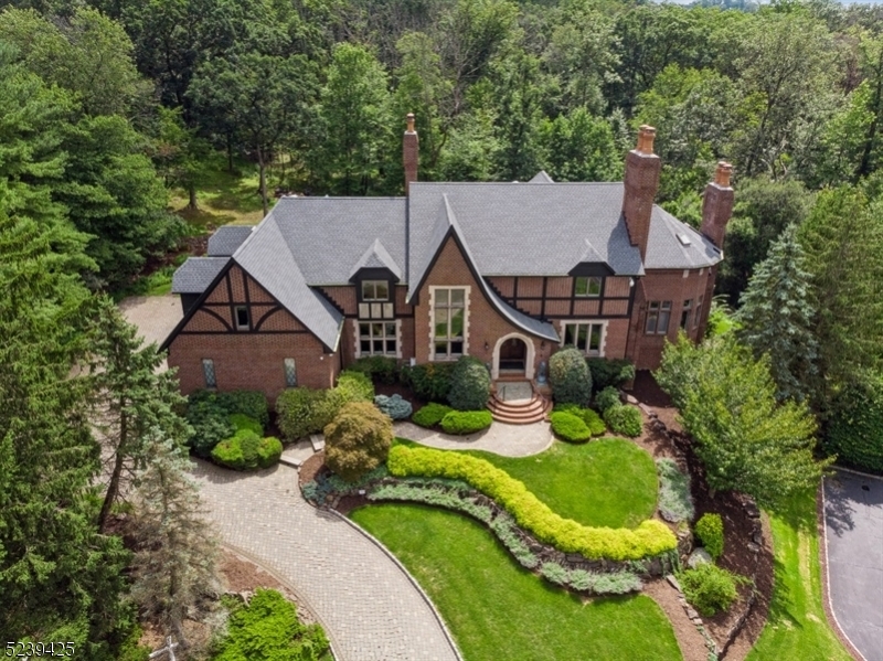 Simply put, there just aren't other properties that offer what this one does in our area-anyplace. the quiet, cul-de-sac, in arguably the best part of town, one of the best streets, on the large wooded wildlife preserve, fully remodeled, custom built home, over 8500 livable sq feet, movie theater, an entertaining masterpiece, massive full house "quiet" generator, gym and sauna just to name a few. Situated on 300 acre wildlife preserve,quiet cul-de-sac,underground utilities,very private setting,Tudor/Colonial with some of the most impressive chimneys you will find,5 bedrooms, 5 full and 1 half baths, GYM(could be converted into 6th bedroom),sauna,movie theater, renovated gunite pool and hottub,all renovations 2022,new roof-gutters-downspouts,chimneys all waterproofed and inspected,new pool plaster, fully renovated bathrooms,entire house painted,floors refinished,full custom kitchen with quartzite counters,custom rangecraft cooking hood,double Miele dishwashers,double Wolf warming drawer,3 kitchen sinks including double faucet 5 sink/workstation,60 Wolf gas stove 6 burner w/ double griddle 2 full ovens,Uline icemaker,Wolf Miele Subzero, 8 1/2 large oval quartz custom kitchen table,double boiler 7 zone system, updated tankless hot water, 11 mounted flatscreen TVs including 85 in the garage,5 zone A/C, exterior and interior security system,home theater w/ 7 power reclining chairs,full house generator only 60 hours just serviced, high end bar with refrigeration, 9 foot ceilings