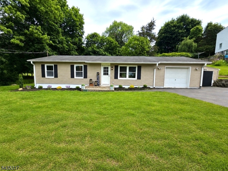 Welcome to this beautifully remodeled 3 Bedroom,  1.5 bath home situated on approximately 1/3 of an acre minutes to Lake Iliff. Designed for today's lifestyle, this home offers peace of mind with a septic system, plumbing, electrical upgrades, 200-amp service, high-efficiency gas furnace, central air, Wi-Fi thermostat, portable generator hookup, and flooring all recently completed. The stunning kitchen features stainless steel Samsung appliances, a stylish backsplash, and contemporary finishes that make everyday living and entertaining a pleasure. Both bathrooms offer stylish finishes and the fresh paint creates a bright, clean, welcoming atmosphere. One of the home's greatest advantages is that the major improvements have already been completed. From the kitchen and baths to the mechanical systems, flooring, and septic, buyers can move in and immediately enjoy their new home without budgeting for significant repairs, replacements, or remodeling projects. Step outside to the patio and spacious yard, offering plenty of room to relax, entertain, or simply enjoy the outdoors. Optional membership to Lake Iliff provides access to a welcoming community and a variety of seasonal events, including movie nights, a Hawaiian Luau, Water Carnival, and other neighborhood activities .A rare opportunity to own a home that combines modern finishes, important infrastructure improvements, generous outdoor space, & access to a desirable lake community lifestyle.