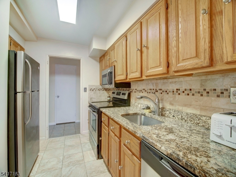 This large Northeast corner 9th floor COOP offers views and a terrace along with 3 bedrooms, 2 baths and original parquet hardwood floors. Here's another opportunity to join the popular Harrison Park Towers COOP community just in time to enjoy the upcoming spring gardens out back and take be a part of the summer festivities. In addition to a 24 hr front desk, onsite management and complimentary jitney services, there is a healthy fitness center and underground parking. Looking for an easier and low maintenance  way to live? Come home to HPT!  Coop board approval (all adults) required and 20% down payment is a requirement. Owner occupied purchases only. Ownership shares - 440. Monthly maintenance $2004 which includes taxes, maintenance and all utilities (heat/AC, hot water, electric). See details on entrance requirements and move-in fees (low closing costs).