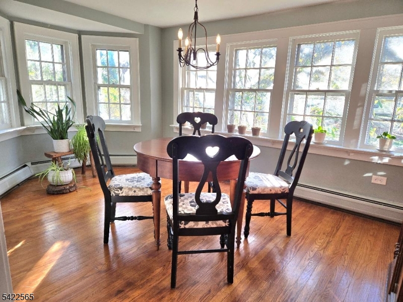 This beautiful corner property home is not a drive by, much larger than it appears, 1 stone fireplace in living room, kitchen, dining room, den with wood burning stove, laundry room with half bath, foyer, sunroom, family room with fireplace and kitchen, bedroom with full bath and walk in closet. 2nd floor primary suite with full bath, linen closet and walk in closet; 2 additional bedrooms and another full bath; large attic with 2 good size windows and electric. full unfinished walk out basement (3 sections) with above ground oil tank can be finished.  20x40 inground pool, large 18x20 shed, 2 decks; home has always been used as one family but is legal two family.  Close one door and there's a 4 room, one bedroom w/full bath for an in law suite on 1st fl with private entrance and deck, if needed.  Close to Mt. Arlington and Dover train stations, close to Rts 23, 15 & 80. Under 1 hour to NY or PA. Close to Golfing, Boating at Lake Hopatcong & Skiing at Vernon Valley. Home is in excellent condition. Yard has many perennials and small bridge to back of property to shed and garden.