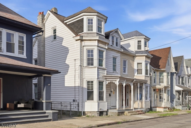 Incredible 2-unit opportunity in Phillipsburg. The first-floor unit has a private side entrance and offers a 2-bedroom apartment with access to the patio area and basement. Unit 2 occupies the second and third floors and includes 3 bedrooms, a bonus room, laundry room, and walk-out deck. The home also features a large unfinished basement with laundry setup, storage space, and additional storage potential. Spacious fenced-in yard with driveway parking for 2 cars, accessible from Cherry Alley at the rear of the property. Separate utilities for each unit. Conveniently located near schools, shopping, major highways Route 78 and Route 22, and less than 3 miles from downtown Easton.