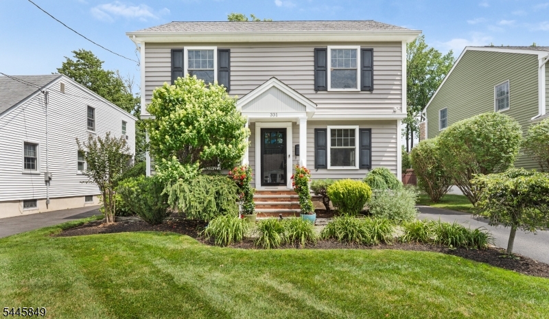 Welcome to this charming Colonial home in Cranford, offering three bedrooms, two-and-a-half baths, and hardwood floors throughout. The spacious kitchen features ample counter space and a separate eat-in area that flows into the light-filled living room, and a dedicated dining room provides an inviting setting for meals and gatherings. The primary bedroom includes a private full bath and a double closet. A partially finished basement with tile flooring offers flexible space for a recreation room, home office, or gym. Outside, enjoy the beautifully landscaped, private fenced-in backyard with a patio perfect for relaxing or entertaining. A detached oversized one-car garage provides convenient attic storage. Ideally located near Cranford's vibrant downtown, shopping, dining, parks, and NJ Transit Station with direct service to New York City. The home is not in a flood zone