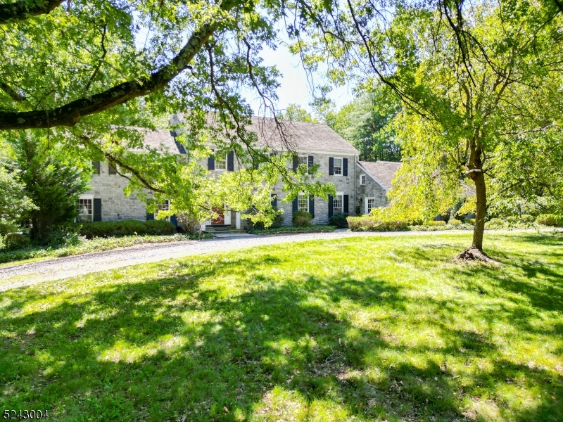 Tucked away down a long circular driveway. This home offers 4 fireplaces, a large kitchen with a center island, custom Corian countertops and sink, adjacent breakfast nook. Living room with wood burning fireplace, large dining room with built-in cabinets, crown molding, wide plank wood floor though must of the home.  The family room has floor to ceiling brick fireplace and beam ceiling. A library room with a wood-burning fireplace. The third level accessible through spiral staircases offers a spacious loft with skylights. Additionally, there is a heated in-ground pool and a house. Large finished room over the three-car garage structure that can serve as an office. A large number of storage sheds with electric lighting. House generator.   The basement is finished with a gas fireplace. The home is surrounded by beautiful landscaped grounds offering plenty of privacy. This property borders 19 Acres of preserved land and Waterman Meadows.  This is an estate sale and it will be sold, Strictly As-It-is.