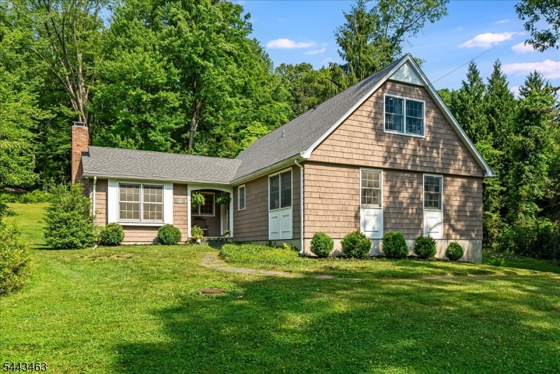 Picture-perfect and full of charm, this beautifully maintained 5-bedroom, 2.5-bath home is tucked away on 2.5 private, tree-lined acres in the highly sought-after Randolph School District. offering the perfect blend of peaceful country living and everyday convenience, this property feels like a private retreat while remaining just minutes from shopping, dining, parks, and commuter routes.Inside, hardwood floors flow throughout most of the first level. The spacious living room with a fireplace opens to the kitchen, while the adjoining dining room and cozy family room create an ideal layout for everyday living and entertaining. Three bedrooms are located on the first floor, while upstairs you'll find a private primary sanctuary with its own full bath, plus an additional bedroom across the hall. Step outside to your own backyard oasis with plenty of room to entertain, garden, play, or simply unwind. Thew peaceful setting all around make this property truly special. Additional highlights include a 2-car garage, full unfinished basement ready for future expansion or storage, new septic system and roof (2024), new hot water heater (2025) etc. If you've been searching for privacy, space, and timeless charm with major updates already complete, this Randolph gem is one you won't want to miss.