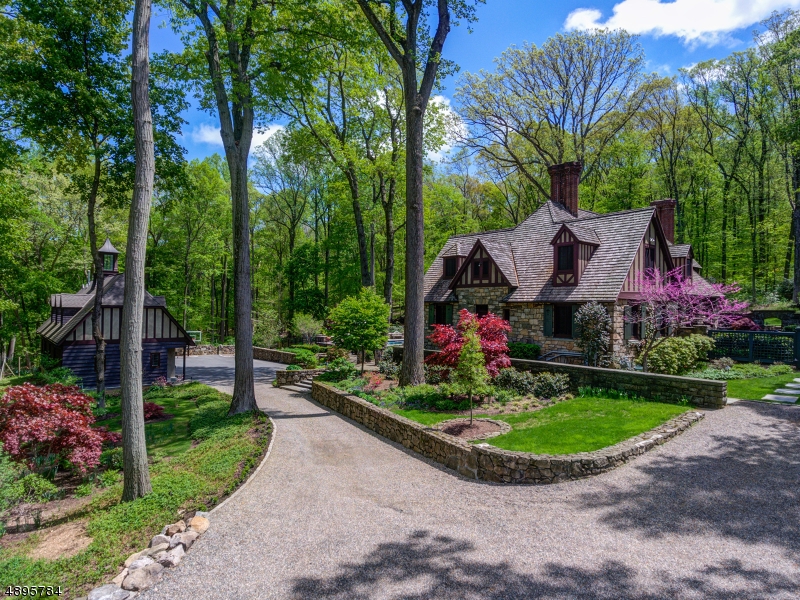 39 Clark Road "Treetops" is one of Bernardsville Mountain's most architecturally unique homes with exquisite indoor and outdoor entertaining spaces. 39 Clark Road "Treetops" is one of Bernardsville Mountain's most architecturally unique homes with exquisite indoor and outdoor entertaining spaces. This estate will appeal to someone who appreciates fine architecture and beautiful countryside views while being just 31 miles from New York City. Featured in several publications for its design mastery, Treetops is a restored carriage house that was once a part of the circa 1916 Stonehyrst estate. It was thoughtfully renovated in 2004, Outdoor improvements include: pool, hot tub, bocce court, outdoor shower, stone fireplace and custom fire pit.