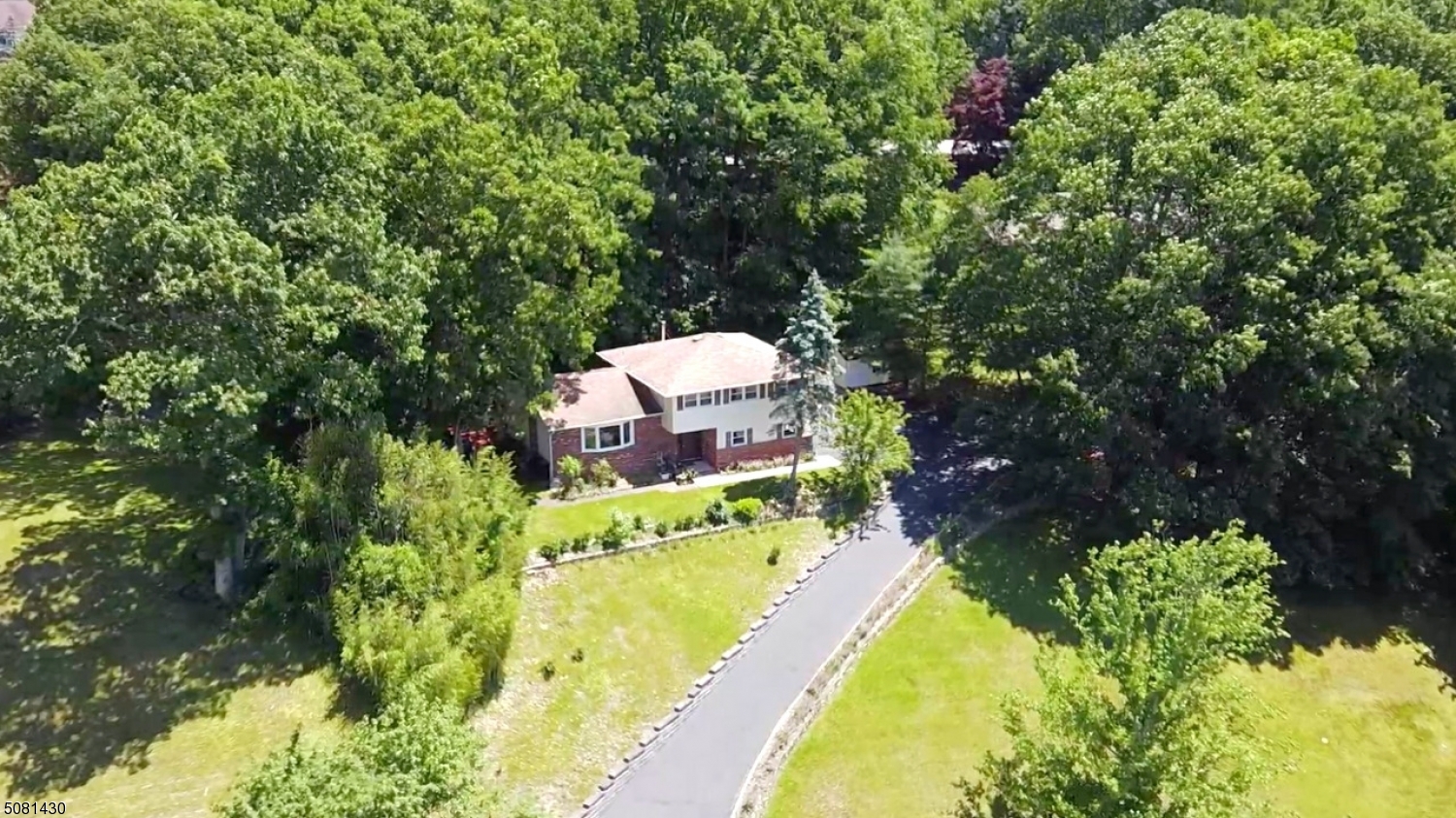 Magnificent & spectacular Split has been well maintained & tastefully updated. It is truly turn key. Offering almost 2,200 sqft of living space across 4 floors & an absolutely perfect floorplan. Good feng shui reported by a certified Geonancer. LR full of light opens to open DR, both w/gorg red oak HW floors. Kitchen features newer counters, backsplash & SS appliances. Upstairs offers a suite w/full bath & walk-in. 3 addtl bdrms & full bath compl the 2nd floor. Ground level boasts a foyer, den w/WB stove, PR, laundry & sliders to back patio & hot tub. Bamboo HW flooring. TONS of storage in semi finished bsmt, shed & oversized 2 car garage. New exterior & interior doors! Striped & re-stained deck. Wooded, private backyard oasis. Great location w/close prox to DWTN Denville, NYC Direct Mass Transit & major hwys