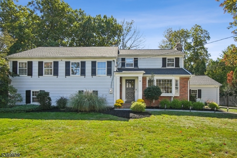 Fabulous expanded & renovated Colonial-Split in highly desirable Poets Section! Stunning gourmet eat-in kitchen, crisp white cabinets, quartz counters, top of the line stainless steel appliances, new Miele DW & new Wolf gas range w/gas FP & vaulted ceiling, pantry, 2 oversized Franke sinks w/ 2 disposals, desk area, wine rack totally open to Family rm w/ 5 new skylights, perfect open floor plan. Living rm w/ bay window, gas FP, dining rm w/ French doors. All new light fixtures 1st level, gleaming refinished hardwood floors, great entertaining space w/ powder room tucked into long entrance hall w/ 2 closets. 2nd level features 3 bedrooms, 2 gorgeous newer baths w/ skylights including the original primary bedroom w/ 2 walk-in closets & a beautiful, large en-suite bath. 3rd level up a few steps & features a luxurious primary suite, all freshly painted, w/2 single closets & 1 walk-in closet off of the spa-like bath w/ double sinks, skylight + oversized shower. Few steps up is a HUGE attic w/tons of storage & attic fan. Ground level features a large rec room w/ 3 windows, cedar closet, office / 5th bedroom w/ separate entrance & powder room. New HVAC 2024, Smart House features heat,AC,garage security, new gas hot water heater 2022, new roof 2021, new garage doors 2025,EV charger 2024. Ideally located on a quiet street in the Poets section walking distance to Hartshorn Elementary School (ranked #3 in NJ), & Gero Park, the town's recreation center w/ tennis, golf & town pool.
