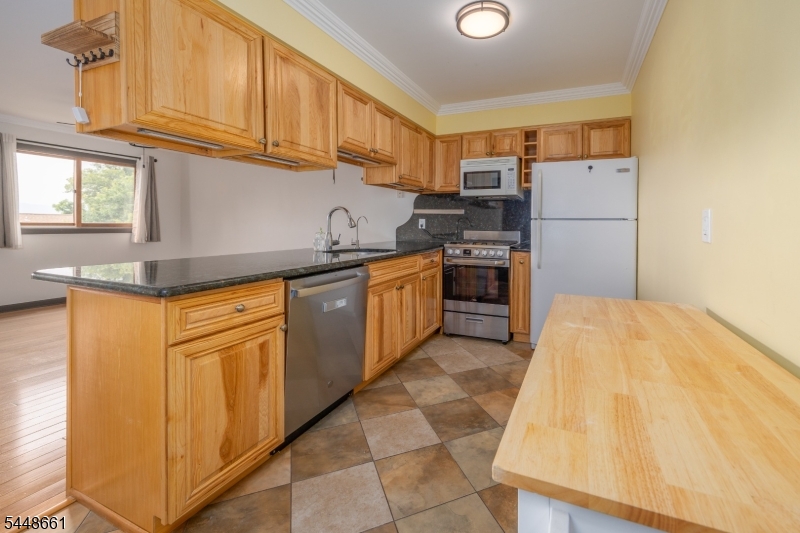 Welcome to this well-maintained 2-bedroom, 2-full-bath interior condominium offering beautiful mountain views and a spacious, versatile layout. Step inside to a bright and inviting main living area with an open flow between the living room, dining area, and kitchen, making it easy to relax or entertain. Large sliding glass doors fill the space with natural light and lead to the upper deck, where you can unwind and take in the scenic mountain views. The main level also features a full bathroom and a spacious bedroom. The lower level offers a private primary bedroom with an en-suite full bath, along with a large bonus recreation/family room ideal for a home office, media room, gym, or additional living space. Plenty of closet space and storage throughout. Move right in and personalize over time. Brand New Roof being installed. Enjoy resort-style living just minutes from Mountain Creek for skiing, snowboarding, water park adventures, hiking, and biking. Conveniently located near Crystal Springs Resort, nationally renowned golf courses, local farms, wineries, orchards, and parks, with Warwick, NY just 15 minutes away for shopping and dining. Whether you're looking for a full-time residence, weekend retreat, or investment opportunity, this is a fantastic opportunity to own in one of Vernon Township's most desirable resort communities.