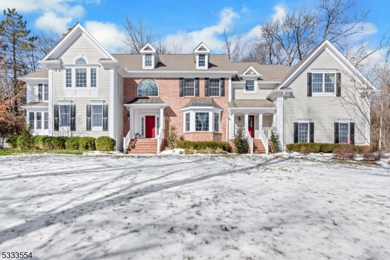 At the end of a quiet cul-de-sac in the sought-after Highland Ridge section of Basking Ridge, this 5,500+ sq. ft. home sits on two private acres, offering a perfect blend of elegance, comfort, and modern updates.  Stunning 2024 kitchen renovation outfitted with Wolf & other high end appliances, double ovens, quartz countertops, and a large center island, combines sleek design with high-end function. Eat-in kitchen area opens to a screened porch, offering the perfect spot for relaxed mornings and summer evenings. The second flr features 5 generously sized BR, 3 ensuite, & 2 BR with a shared Jack & Jill bath.3 newly renovated bathrooms bring a fresh, modern touch to the upper level.The primary suite has been brilliantly reimagined and renovated to include both sitting & sleeping areas, gas FP, spacious bath, along with custom walk-in closets designed to make mornings effortless. With 2 dedicated 1rst flr. home offices & a pool rm, there's space for both productivity and play. The fully finished bsmnt adds another 1,350+ square feet of recreation, storage space & endless possibilities. Heated saltwater gunite pool & spa invite you to unwind, cul-de-sac location ensures peace and quiet. Whl hs gen., newer roof & gutters, upgraded wireless alarm system. Highland Ridge living offers the perfect combination of privacy within a neighborhood. Thoughtfully designed and recently renovated, this home delivers a seamless blend of elegance and functionality for modern living.