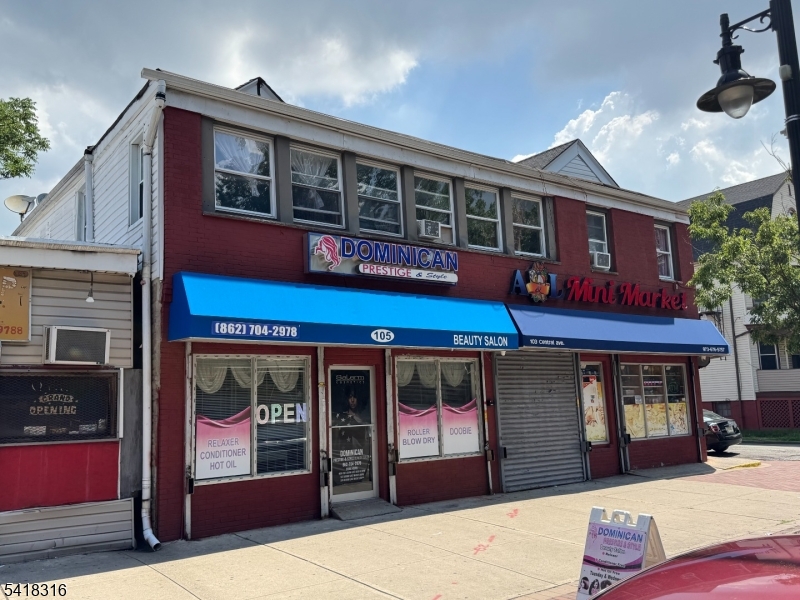 This two-story, mixed-use building is constructed of concrete block and frame, featuring a total of seven fully occupied units two commercial spaces on the ground floor and five residential apartments above.  The commercial units are leased to long-term tenants who have benefited from the property's high visibility and steady traffic count.The residential component consists of (2) Three-bedroom apartments and (3) Two-bedroom apartments.   All residential units have been renovated within the past 10 years. Utilities are fully separated, and three of the five apartments are equipped with in-unit HVAC systems.