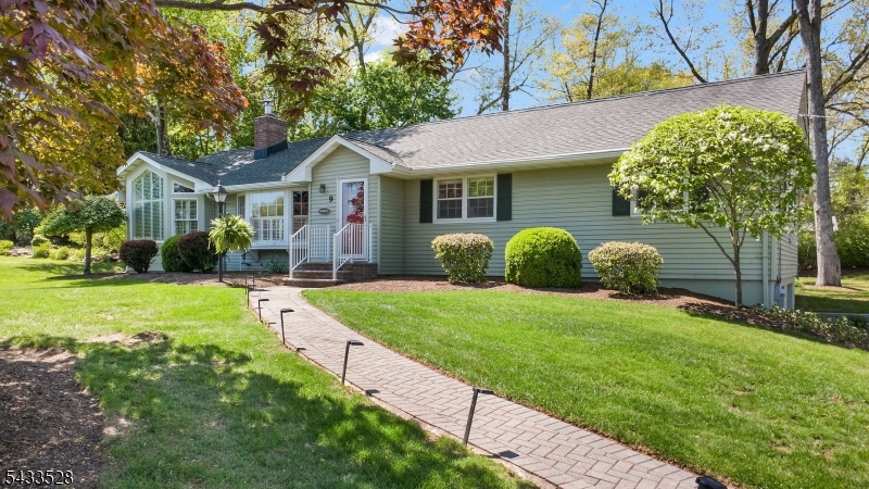Beautifully updated ranch-style home in move-in condition, ideally located in a highly desirable neighborhood with top-rated schools and a commuter-friendly location   just a short drive to the train and only minutes from most major highways. This spacious home features 3 bedrooms and 2.5 baths with an open-concept design, soaring vaulted ceilings, and gleaming oak hardwood floors throughout. The updated white kitchen offers new appliances, abundant cabinetry, and flows seamlessly into the main living and entertaining spaces.The luxurious primary suite includes a huge walk-in closet and an oversized soaking tub for the perfect private retreat. A full partially finished basement with a full bath provides endless possibilities for recreation, guests, home office space, or extended living, plus tons of storage. Enjoy outdoor living in the private backyard surrounded by mature trees and shrubs, complete with brand-new engineered decking. Additional highlights include a 2-car oversized side-entry garage, excellent curb appeal, and pride of ownership throughout. A rare opportunity combining comfort, convenience, and style.