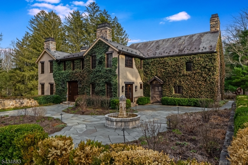 Set on 6 breathtaking acres backing directly to Black River Park w/ private park access, The Herb Farm is a once-in-a-generation country estate where history, romance & luxury exist in perfect harmony. Originally a stone barn dating back to circa 1750, this extraordinary compound has been masterfully transformed into a cinematic retreat evoking the timeless elegance of the European countryside. Beyond the gates, a long winding drive leads through storybook scenery before revealing the stone-clad main residence, privately enveloped by preserved parkland. Main residence features rich architectural character including groin, barrel & vaulted ceilings,mahogany windows, stone walls, & 5 wood-burning fireplaces. A stunning kitchen anchors the home w/ La Cornue stove/oven, Sub-Zero refrigerator, 2 dishwashers & seamless entry to a sunlit stone great-room.The primary suite is a true sanctuary w/ its own foyer, balcony, custom closet & imported marble bath. Magical outdoor living w/ expansive terraces, an indoor-outdoor kitchen w/ an imported pizza oven & Argentine grill & a bocce court overlooking sweeping views. Property is also home to a fully renovated guest cottage & a charming carriage-house suite above the 3 car garage. Updated mechanicals & a full-property generator provide effortless modern comfort. Just 1 hour from NYC, yet feeling worlds away, The Herb Farm is more than a home, it is an extraordinary estate where every season feels cinematic & every detail tells a story.