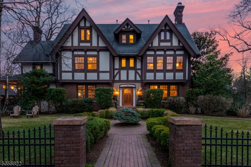 STUNNING UPP MONT TUDOR W/GORGEOUS ARCH DETAILS & RENOVATED W/EXCEPTIONAL QUALITY. 7-bdrm home has gracious foyer, elegant liv rm w/WB frplc, windowed snrm/tv rm & library/sitting area. Form din rm w/frplc & wd paneled 1st flr off. Completely updated kit w/skylight in brkfst area, Calacatta marble island, 48-in 6-brnr Wolf stove, Mliele fridge, 2 Miele dshwshrs, butler's pntry w/wine fridge, pot-filler, Wolf warmer drwr, blt-in cabinetry w/tv & Fr. drs ldg to trex deck for outdoor dining. Deck overlooks fully fenced bkyrd w/blue stn patio & park-like yard. PIcture-worthy mdrm w/lots of hooks, cabinetry & storage. 4 bdrms 2nd flr. Prim suite has huge drssg rm, full bth w/soaking tub & stall shwr.  Full bsmt w/walkout & brand new W&D. Premier loc blcks fr UM train, bus, town, rests, parks & shops.