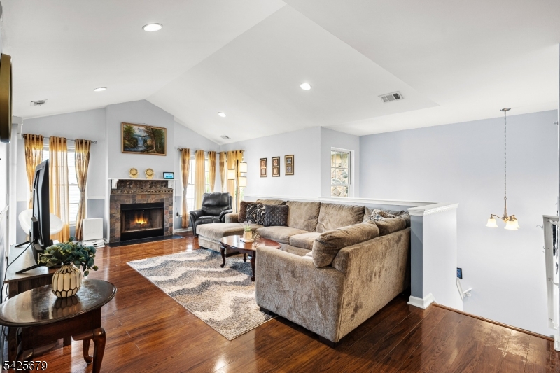 Welcome to Your Perfect Blend of comfort, Style & Location! This beautifully maintained 2-bedRm, 2-bathRm condo in the highly desirable Maple Grove / Maple Woods community offers open-concept layout with soaring vaulted ceilings, large windows, and abundant natural light throughout. The inviting living and dining area is anchored by a cozy wood-burning fireplace and flows seamlessly to a private covered balcony/patio perfect for relaxing or entertaining. Recent upgrades 2025 & 2026 Brand New Boiler (2025), Brand new washer & dryer (2026), Updated main bathroom (2025) with new tile & vanity, nest thermostat, Custom chair moldings, & Recessed lighting. The updated kitchen offs ample cabinetry, ceramic tile flooring, & functional workspace, ideal for everyday living. The primary suite features a large closets and private en-suite bath, while the second bedroom provides generous space for guests, or a home office. Enjoy the ease of plenty of free parking and low-maintenance living w/community amenities including a pool, tennis Ct, playground, & garbage pickup. Unbeatable location close to maj highways (Rt-287, 1, 18,Tpk, Gsp),Rtg/UMDNJ University, shops etc making this a true commuter's dream & investment opportunity.