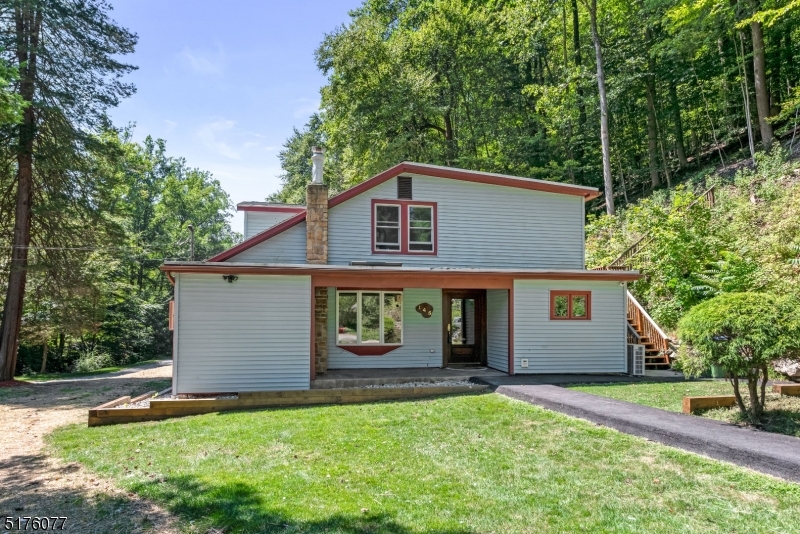 This custom cape is nested on 2.39 AC of total privacy. A beautiful brook surrounds this property adding to the peaceful environment. The home features 3 bedrooms, pine wood floors on the second level, a master bedroom with French Doors to a private deck, and a living room with French Doors to the side open porch which has outdoor heating. Kitchen with Corian countertops and gas stove powered by propane gas. There is a generator in place. This home comes with a brand-new septic system. Roof replaced 2018, new electrical panel totally rewired 2022, security system stays.  Awesome country settings!