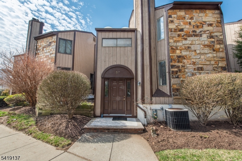 Welcome to this inviting patio home in the desirable Hastings Square community, offering comfort, style, and convenience in one perfect package. The main level features a spacious living and dining area highlighted by bamboo hardwood floors and abundant natural light. The kitchen includes an eat-in area, pantry, and sliders from both the kitchen and dining room that lead to a large deck overlooking a peaceful garden setting perfect for relaxing or entertaining. Upstairs, you'll find a generously sized primary bedroom with a full en-suite bath featuring a tiled stall shower. Skylights on the mid-level landing fill the home with natural light and a warm feel. The lower level offers a basement with laundry and ample storage, with direct access to an oversized two-car garage for added convenience. Community amenities include a pool, clubhouse, tennis courts, and playground. Ideally located near shopping, dining, transportation, and a highly regarded school district this home offers low-maintenance living in a prime location.