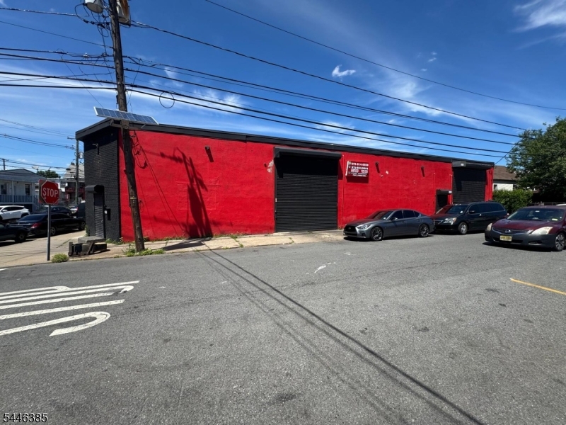 277 East 16th Street, Paterson, NJ is 5,500 square-foot industrial warehouse available for lease immediately. The property is in Paterson?s I-1 Light Industrial zone and features 16-foot clear ceiling height, two grade-level drive-in doors, an open warehouse layout, bright overhead lighting and suspended heating.The building has a strong industrial look with painted masonry walls, red steel beams, concrete flooring. The exterior has direct street-level access and a practical urban warehouse design that gives a business good visibility and branding potential.The space will work well for warehousing, storage, distribution, contractors, light manufacturing, assembly, equipment operations or similar approved uses. The location is easy to get to and is near major streets and highways.