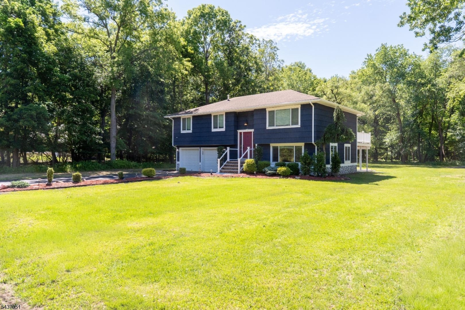 Don't miss out on this renovated and updated 3 bedroom, 2 full bathroom Bi-Level set on a beautiful, open and level 0.46 acre property in a very quiet and peaceful neighborhood. The open concept main level features a renovated center island kitchen with white cabinetry, stainless steel appliances, and quartz countertops seamlessly flowing into the dining room which opens to the spacious living room. Don't forget about the sliding glass doors which open to the newly refinished trex deck and overlook the wonderful property. The main level is complete with a master bedroom, a renovated main bathroom with double vanity and tub shower, and 2 additional bedrooms. The lower level features a large family room (part of which could be closed off and used as a 4th bedroom), plus sliding glass doors to an expansive stamped concrete patio, a renovated full bathroom and access to the 2 car garage. The home sits on an open, level and private 0.46 acre lot with a large shed. Don't forget about the public utilities, natural gas, central air, recessed lighting, hardwood floors, fresh neutral paint, don't miss this one! Flood Insurance is required