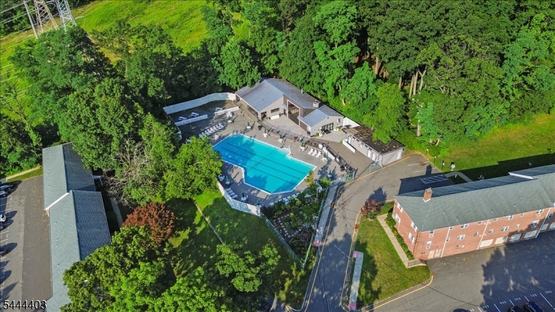 This 2-bedroom unit in the Mountain Club features a renovated kitchen with granite countertops and stainless-steel appliances! The spacious layout features an open living room and dining area with recessed lighting, along with a primary bedroom that offers dual closets. You'll also find an on-site laundry area and a private storage closet for added convenience. The monthly HOA fee covers heat, water, gas, sewer, and trash helping you keep monthly expenses predictable. Residents enjoy access to a pool, clubhouse, fitness center, and more! Garage parking is also available for an additional monthly fee. Conveniently located near major highways, shopping, dining, and train stations - this home offers easy commuting and comfortable everyday living. Don't miss out... schedule your showing soon!