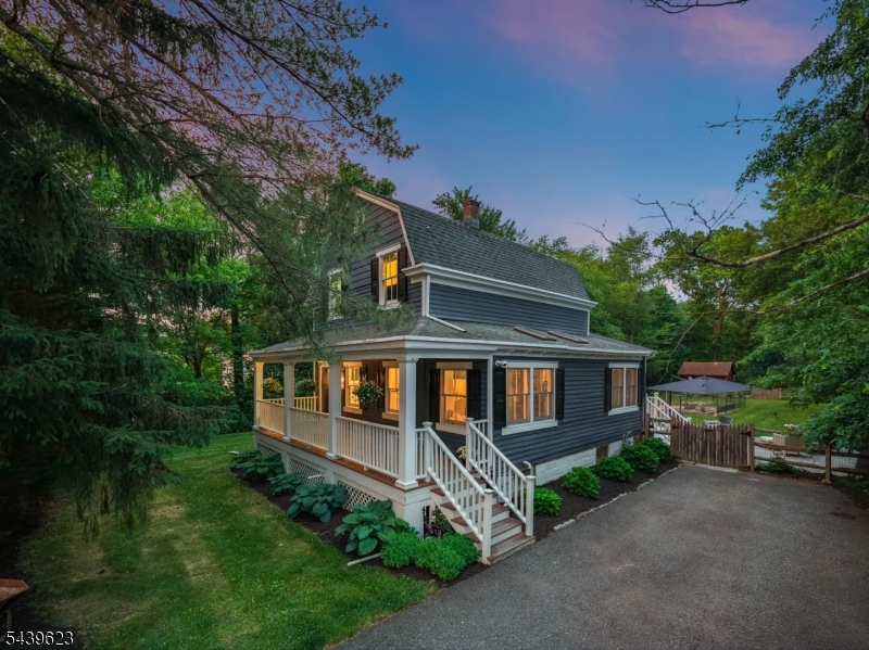 BEAUTIFULLY MAINTAINED 3-BED ON GORGEOUS PROPERTY MOMENTS FROM NYC DIRECT TRAIN. Covered Front Porch is a warm welcome w/ flowering plants, meticulous landscaping & siding in a perfect shade of blue. The bright, cheerful & thoughtfully updated first level boasts hardwood floors, recessed lighting, crown molding & an incredible floorplan w/ expansive living spaces. The gorgeous Foyer leads into a Spacious Dining Room w/ timeless board-and-batten moldings & a stylish new light fixture. Chef's Kitchen is true heart of home w/ warm wood Shaker-style cabinetry, expansive granite countertops, s/s appliances inc. dishwasher & fridge. The granite-topped breakfast bar is perfect for quick weekday meals and early morning coffee. Kitchen flows perfectly into stunning, light-flooded Sunroom w/ skylights & Windows on every exposure. Sun-filled Living Room was a new addition in 2017 and is ideal for hosting gatherings or enjoying cozy nights curled next to gas fireplace. Full Bath boasts classic tile & rain showerhead. The tree-lined, level Back Yard with a gorgeous paver patio is an idyllic retreat, offering fruit trees, fenced garden w/ raised planter beds & plenty of grass for warm summer evenings. 2nd Level has 3 nicely-sized Beds & a Full Hall Bath w/ tub/shower. Lower Level offers renovated Rec Room with luxury vinyl wood-look flooring, ample Storage. Great location close to major hwys w/ easy access to shopping/dining/more. Don't Miss 413 Mountain Ave!