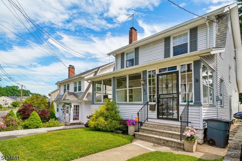 Modernized 1920s Colonial in Coveted Lourdes Section. Welcome home to this sun-filled 3BR, 1.5BA Colonial blending timeless 1920s charm with a 2018 renovation. Standout features include a rare open-concept main floor plan, a first-floor powder room, an updated second-floor bath, and a dual-zone HVAC system providing central air and forced heat. The first floor boasts elegant crown molding, recessed lighting, a charming wood-burning fireplace, and seamless flow into a chef's kitchen complete with premium stainless steel appliances, stone countertops, and a matching stone backsplash. Step through sliding glass doors to a new deck and beautifully manicured lawn perfect for indoor/outdoor living. The home also features a lovely three-season front porch, a 3rd-floor walk-up bonus room, security system, and a new hot water heater. Rounding out this property is a full basement, detached garage, and a private driveway for 3+ cars. Location Highlights: A commuter's dream! Less than a 5-minute walk to the local Jitney (under 30-minute direct train line to NYC) and 15 miles west of New York City. Enjoy easy access to Rt 280 and the Garden State Parkway. Live just under 10 minutes from Downtown Montclair's vibrant shopping, dining, theaters, and museums.
