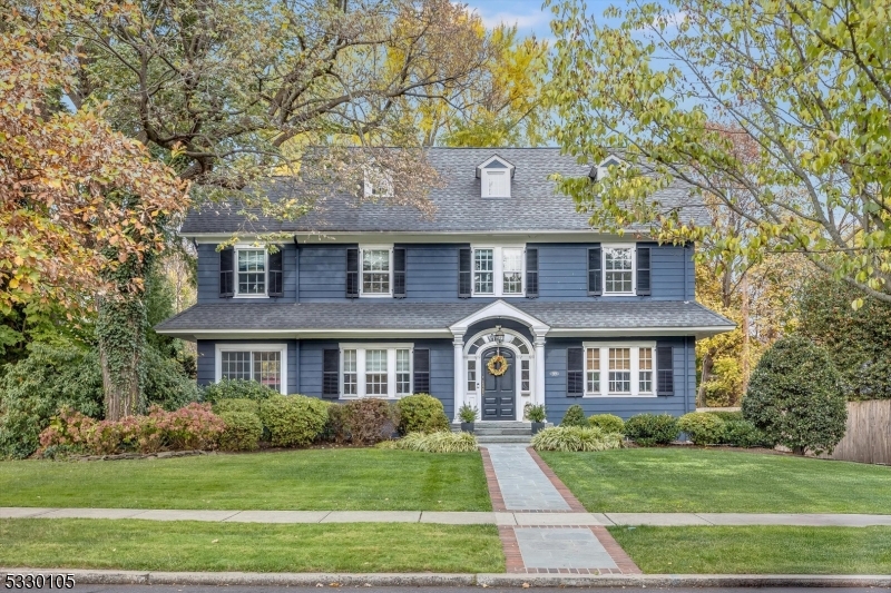 A most gracious and elegant 5 bedroom center hall colonial beautifully appointed with gorgeous original Details and character throughout including high beamed ceilings and mouldings, arched entry and hardwood flooring throughout. A perfect combination of yesterday with all the modern amenities of today. The center hall flow allows for seamless daily living. Entertaining is a dream throughout the 1st floor and leading directly to the stunning backyard and patio complete with built-in grill, spacious prep counter and large built-in gas fire pit. Upstairs the sophisticated primary ensuite bedroom BOAsts a spectacular custom walk-in closet and renovated bathroom. Two additional bedrooms and a full bath round out the 2nd fl all adjacent to exquisite staircase and landing. A spacious 3rd fl awaits with a bedroom/office and an additional bedroom with a separate room perfect for homework or a dressing area plus a 3rd fl hall full bath. Excellent for guests. The fully finished basement (with French drains) is the center of activity and the perfect spot for fun and play! Loaded with built-ins, storage, a large laundry room with mudroom area and a half bath. All this and located in the sought-after north end neighborhood of historic Glen Ridge, it's highly rated NJ school system and the hub for the NYC Midtown direct train. Top that with its close proximity to trending Montclair restaurants, shops and famous farmer's market. Welcome home!