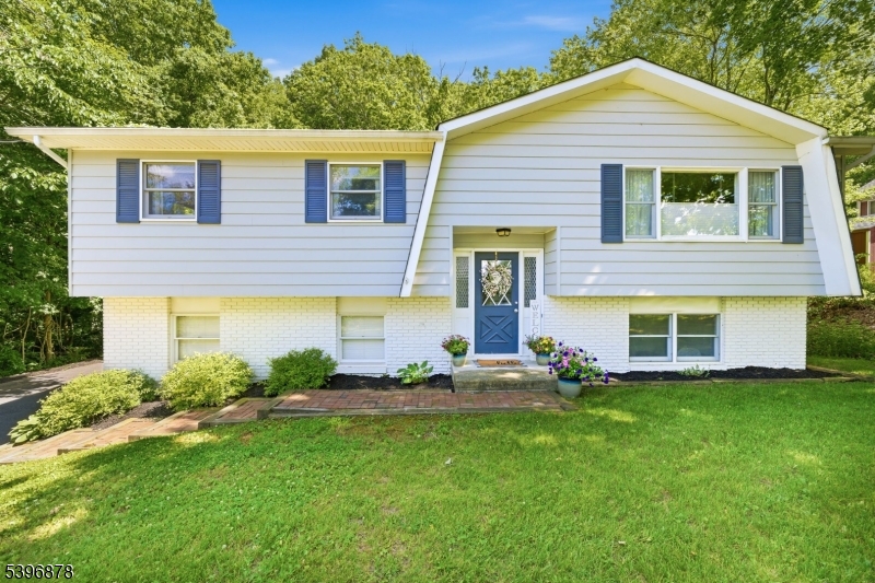 Welcome to this beautifully updated bi-level in desirable Fredon Township! Offering 3 bedrooms and 2 full baths, this home blends modern updates with peaceful Sussex County living. Set on a quiet dead-end road, the home features refinished hardwood floors, fresh paint, raised-panel doors, crown molding, recessed lighting, and central air. The stunning custom kitchen boasts granite countertops, farmhouse sink, luxury vinyl plank flooring, stainless steel appliances, and abundant cabinetry. Both bathrooms have been tastefully updated with quality finishes. The bright main level offers spacious living and dining areas, while the lower level provides flexible living space including a large family room, den, utility room, workshop, storage area, and office with outside access through the sliders and garage. Two-zone heating and central air provide year-round comfort. Major improvements include a 3-bedroom septic system replaced in 2019, new roof in 2019, updated kitchen and baths, refinished hardwood floors, lighting fixtures, and more. Enjoy the large private backyard, beautifully landscaped front yard, and serene country setting. Conveniently located near Swartswood Lake, parks, hiking trails, Kittatinny Regional High School, and Routes 206, 94, and 15 for an easy commute. Experience the perfect combination of rural charm, modern updates, and move-in ready convenience. Sale is contingent upon sellers' purchase of a new home, currently under contract.