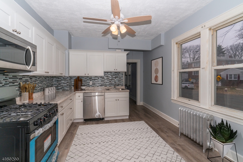 Looking for a totally renovated home that is walking distance to the train station? This is it!!! Gorgeous cape with enclosed porch, great size living room, 4 bedrooms and 1 full bath. Kitchen was totally renovated, SS appliances included. Brand New Boiler installed and newer water heater.  First floor with beautiful laminate floors and second floor with new carpet. Great size bathroom located on first floor.Unfinished basement with endless possibilities and a great size detached garage. Great location, great price and great taxes. Walking distance to downtown, and access to major highways. A must see!