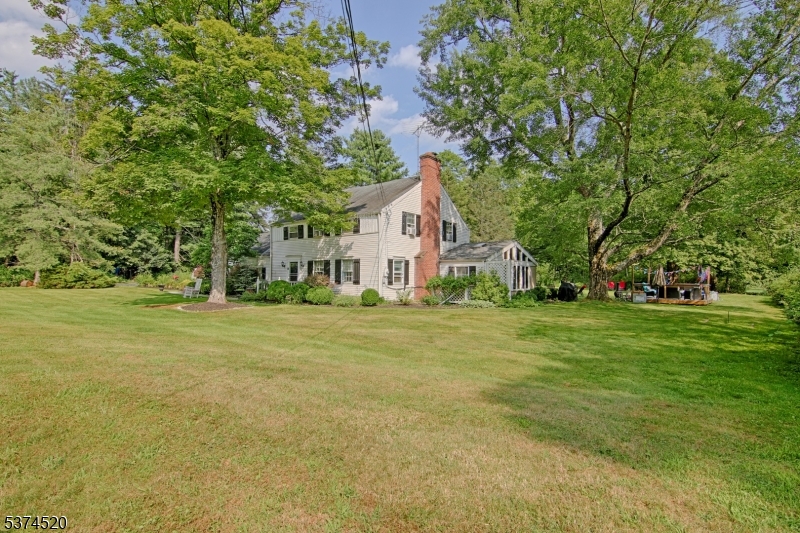 Picturesque Colonial home residing on nearly 10 aces. Located less than 2 miles from downtown Bernardsville and 2.5 miles from central Far Hills. Rich wood floors and abundant natural light carry throughout this charismatic home. Rustic beam ceilings add to the charm. Country Kitchen offers granite counters and stainless appliances.
