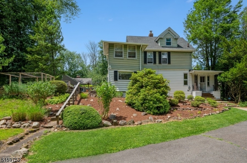 Bright and spacious home in a convenient location! Charming, well-maintained sits on an oversized, manicured lot in an ideal residential neighborhood. Within 2 min of schools, this home is convenient to major highways including Rt 24 & 78, a country club, golf course & just minutes to the train station for an easy commute to NYC. There's a lot to love about this warm and welcoming home, from the terraced rock garden front yard & entry to the light-filled interior featuring hardwood flrs, crown molding & trim work Details, a finished attic level & great natural lighting. The living and entertaining areas flow outside to a sunny deck & deep back yard wi/a dog run bordered by mature trees providing plentiful space for gardening, playing & relaxing. The vestibule opens to a spacious, open LR & dining area. The large eat-in kitchen offers ample cabinet & counterspace, rm for a dinette by the large window & access to the porch & deck overlooking the private backyard. The flow continues to a 1st flr Bd perfect for guests & a full Bth w/washer & dryer. The 2nd flr includes a large primary Bd w/a cozy sunroom, a 3rd Bd, a hallway Bth & an office. The finished attic space offers even more living space for a playroom or den. The basement contains the utilities & extra storage. Along with a nearby nine-hole municipal golf course & a seasonal aquatic center, this home situated within easy reach of The Mall at Short Hills and just 15 min to Newark International airport