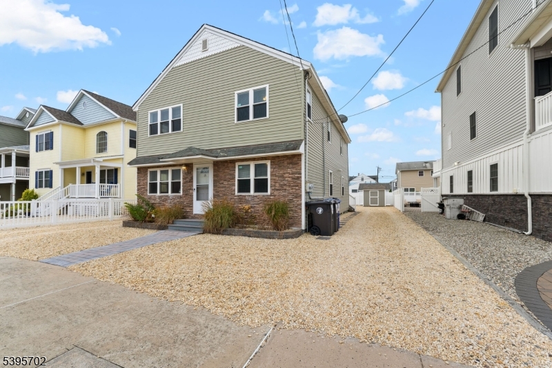 Location, Location, Location! Rare opportunity to own a two-family home on the coveted beach block just steps from the ocean and within walking distance to popular restaurants, shops, and local attractions.Currently used as a successful seasonal income-producing property, this versatile home can easily serve as a primary residence, vacation home, or investment property. Each floor offers 3 spacious bedrooms and 1.5 baths, along with tasteful finishes including granite countertops, wood-plank tile flooring, and beautifully finished oak hardwood floors. Both units also feature in-unit washer and dryer, providing added convenience for residents or guests.The home is being sold fully furnished, making it truly move-in or rental ready. Additional highlights include two large locking storage sheds, an outdoor shower, and two new central air conditioning units.Outdoor living is designed for relaxation and entertaining. Each unit includes Polywood patio dining sets with seating for eight, retractable , and two outdoor propane grills. The upper unit features sliding glass doors that open to a spacious composite deck, while the lower unit enjoys a private paver patio.Off-street parking for up to 8 vehicles, including driveways on both sides of the home accommodating 4 cars each.Whether you're looking for a turnkey beach investment, a summer getaway, or a year-round residence, this property offers an unbeatable location and exceptional versatility.