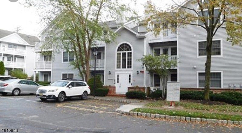 Beautiful home in move in condition.  This 2 bedroom, 2 full bath condo is bright with an open floor plan. Updated kitchen with granite countertops and updated appliances with a breakfast bar and built in breakfront with extra cabinets and granite top. Features include updated bathrooms, walk in closet, laundry and utility room with brand new large stackable washer/dryer, water softener,window blinds, ceiling fan, exterior storage area, 2 decks with scenic view.  Also offers tennis courts, in ground pool, club house, walking track.  Close to schools, train, and major highways.  A must see!!