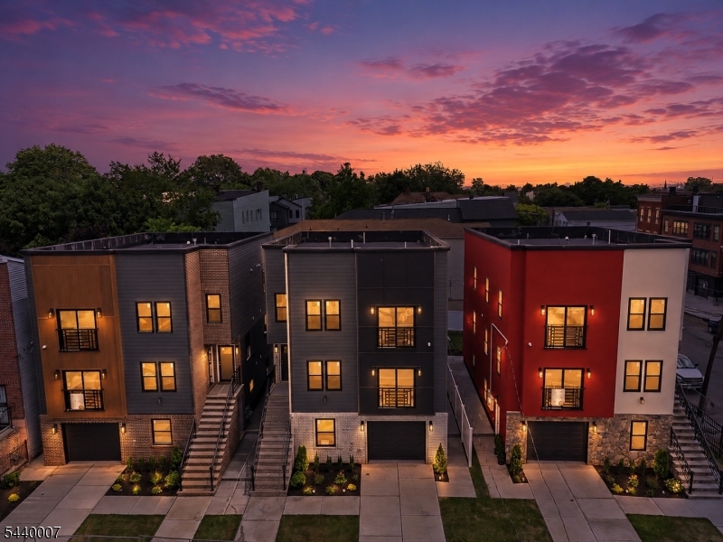 The multifamily game has changed, and these homes are proof of it. Designed with intention and built to stand apart, this is anything but your typical new construction. Every detail has been carefully curated, from the striking facade contrasts and unique architectural designs to the thoughtfully planned landscaping, all tailored to complement today's lifestyle. We are fortunate to offer only three of these exceptional residences. The wait is over. Welcome to these beautifully sized homes featuring a ground level designed for both functionality and entertaining, complete with an open flex space, a half bathroom, elegant tile work throughout, a two car tandem garage, and sliding doors leading to your private paved patio and grassy backyard. Each home offers two spacious apartments, with every unit featuring three bedrooms and two full bathrooms, including a primary suite. Unique accent walls, designer finishes, Juliet balconies, oversized living areas, and stunning kitchens with abundant cabinetry and peninsula seating complete the experience. Offering a total of six bedrooms and five and a half bathrooms, these homes are conveniently located near major highways, airports, public transportation, shopping, and more. You need to see them in person to truly appreciate everything they have to offer. *** 5 YEARS TAX ABATEMENT ***