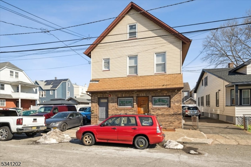 Investment Opportunity in Wallington, NJ!This versatile mixed-use property offers incredible potential for both residential and commercial use. The main level features a fully operational bar, perfect for continuing its current use or converting into another commercial space to suit your business needs.On the second level, you'll find a spacious 2-bedroom, 1-bathroom apartment, complete with a full kitchen and a private balcony ideal for an owner-occupant or rental income. Additionally, the unfinished walk-up attic provides ample storage space with the potential for future development. Outside, a generous backyard offers a welcoming retreat or additional possibilities. Whether you're an investor seeking rental income, an entrepreneur looking for a prime business location, or someone with a vision to transform the space, this property presents a rare opportunity to make your mark in Wallington, NJ!