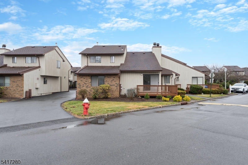 Welcome to one of Florham Park's most desirable gated townhome communities! 250 Ridgedale Ave, Unit Q1 is a fully refreshed and move-in ready 2 Bedroom, 2.1 Bathroom end unit with a cathedral Living Room, Family Room with fireplace, recently updated Kitchen and wraparound deck. Huge Primary Bedroom offers two walk-in closets and large Bath with double vanity. There is a large full Basement that is great for storage and a one-car Garage. Amazing amenities including tennis and sports courts, and outdoor pool. Large shopping centers and restaurants close by and quick access to all major highways.