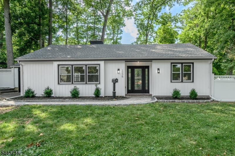 Beautifully renovated 3 Bed 1.5 Bath Ranch with Master Suite, 1 Car Garage, and bonus Workshop in thriving Plainfield is sure to impress! Meticulously redesigned with plenty of modern, luxurious upgrades all through, move-in-ready and waiting for you. Curb appeal gives way to a spacious and sophisticated interior with generous room sizes, new flooring that shines, recessed lighting, new fixtures, and plenty of natural light all through. The accessible open layout makes for comfortable living and entertaining, featuring a light and bright living room with gorgeous fireplace that is perfect for those crisp nights, flowing seamlessly into the elegant dining area. The upgraded gourmet eat-in-kitchen will delight any home chef, offering sleek SS appliances, gleaming quartz counters, a breakfast bar, and ample cabinet and pantry storage. Down the hall, find the main bath with tub shower and elegant ceramic tiling, the dedicated laundry room, and 3 generous bedrooms with lighted ceiling fanst, inc the Master Suite. MBR boasts its own ensuite 1/2 bath along with a walk-in closet. Peaceful outdoor area holds a large deck that backs to private wooded views, fenced-in for your privacy and comfort. Oversized 12x12 shed makes a great workshop and offers plenty of storage. 1 car garage protects from the elements. All in a sought after neighborhood, close to schools, parks, shopping, dining, public transit, and major roads for an easy commute. *CS - Showings begin Friday 7/3*