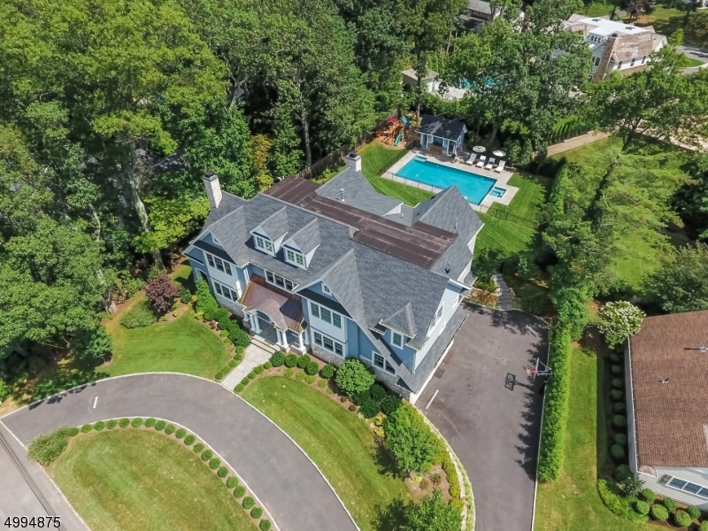 Imagine living in a custom built vacation home full-time! This classic Hampton style beauty with pool & cabana is only 5 years young built by one of the most respected Short Hills luxury builders:  Comfort and elegance are expertly blended and evident from the moment you arrive.  You instantly feel the upscale yet casual lifestyle within the spacious and easy interior layout.   Rooms flow seamlessly throughout.   The kitchen is truly the heart of the home with views of the vacation lifestyle setting, showcasing the stone patio, gorgeous pool and pool house.  This perfect property on the coveted Deerfield cul-de-sac makes it an ideal Short Hills home for living and entertaining.
