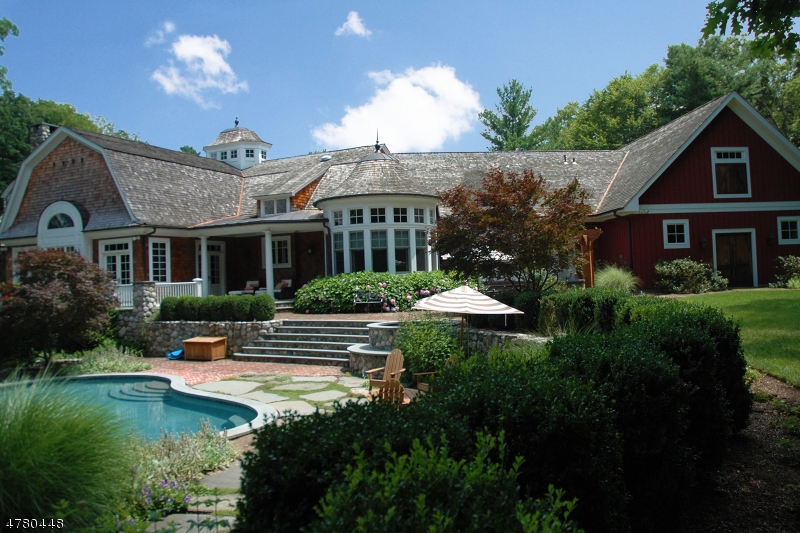 New Construction over existing foundation in 2006. Extra High ceilings and wide planked wood floors throughout. Amazing Woodwork and Moldings, all radiant heat...Enjoy the summer by the Infinity edge pool with waterfall or the hot tub! Five private acres on a cul-de-sac. Custom Kitchen imported from England and installed on site. The Primary suite has a fireplace & huge walk-in closet, and the Primary Bathroom has dual vanities, spacious shower and separate soaking tub. Double French doors lead from the bedroom to the terrace with a fireplace and stunning view of the lake. Garden level has outside access, a huge unfinished area (in-law Suite) to design as you need! Potential for subdivision, 2 horses with corral, or could be tennis or plenty of cars!