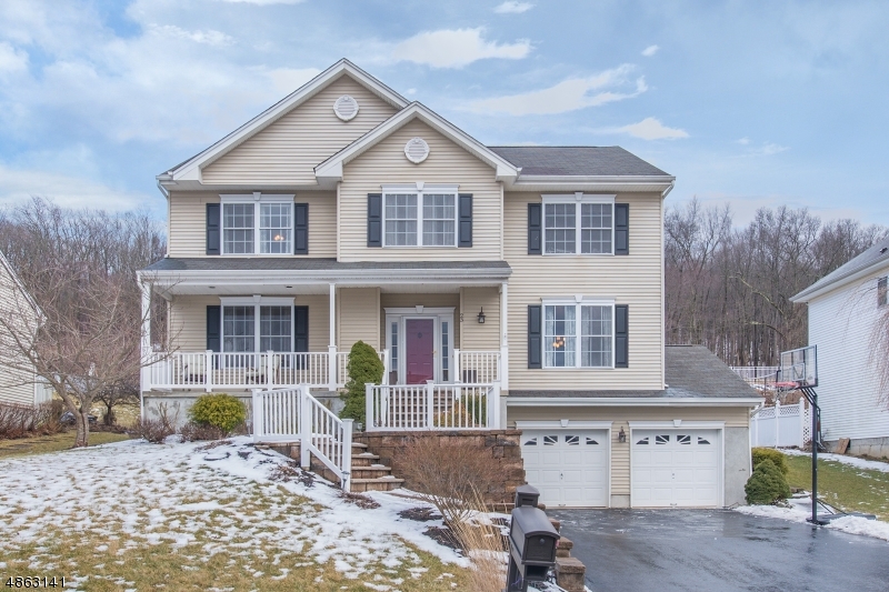 Stop searching! Your house hunt stops now! Gorgeous 5BR in desirable Brittany Hills with all the bells and whistles including wood floors throughout; extensive moldings; maple kitchen with granite, stainless and large center island with breakfast bar is open to the family room with floor to ceiling stone fireplace; finished basement with double door access to 2c garage; spacious bedrms including the Master with attached full bath with jetted corner tub and walk-in closet with organizing system; LR with French doors; Formal DR; first floor laundry and powder rm.  Rocking chair front porch and partially covered paver stone patio for outdoor entertaining rain or shine. Top-Rated West Morris school district. Public utilities. EZ access to Rte 46 and Hackettstown's vibrant downtown dining & craft brew scene.