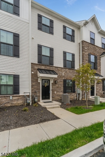 Welcome to 114 Bergen Street, a nearly new 'Mozart' model townhome just a short stroll from vibrant downtown Hackettstown. The entry level offers a versatile flex space ideal for a home office, gym, or playroom complete with a convenient half bath and direct access to the two-car garage. On the main level, you'll find a beautifully designed open-concept kitchen featuring an expansive island with seating, upgraded white cabinetry, quartz countertops, stainless steel appliances, and a stylish tile backsplash. The kitchen flows effortlessly into the dining area and a bright, airy living room perfect for both everyday living and entertaining. This level also includes luxury plank flooring, a powder room for guests, and access to a rear deck an inviting spot for morning coffee or relaxing at day's end. Upstairs, the spacious Primary Suite boasts a tray ceiling, a large walk-in closet, and a private ensuite bath with a dual quartz vanity and a tiled Roman shower with dual shower heads. Two additional generously sized bedrooms, a full bathroom, and a convenient laundry room complete the upper level.Enjoy all of this just steps from shopping, restaurants, breweries, coffee shops, and the train plus the added benefits of a 5-year tax abatement and a transferable HOW warranty.