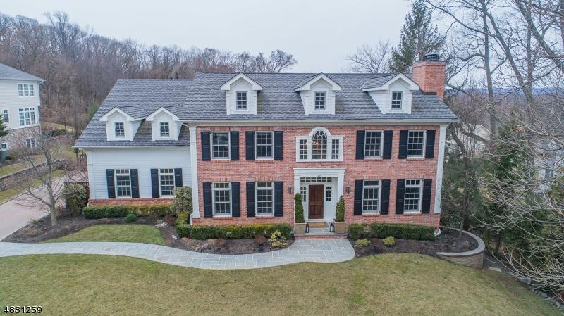 Better than new!  Upgrades across every inch of this Harvey Caplan home.  Last stop on the most recent Chatham PTO house tour.  Stunning center hall colonial w/ approx. 5800 square feet on 1st and 2nd flrs. Approx. 2000 sq ft finished/walkout basement. Extremely functional flow and layout w/ 5 bedrooms and laundry room on 2nd flr. Additional in-law suite on 1st flr and an au pair suite in basement. Expansive high-end kitchen is a chef and entertainer's delight. Beautiful cabinetry, SS Wolf & Sub-Zero apls, carrara marble counters and separate 17x12 breakfast room. Family rm w/ coffered ceiling, custom cherry wood library, millwork, built-in's, and light fixtures to rival any designer showroom. Luxury master suite with fireplace, sitting room, and spa bath. Warmth meets sophistication throughout.