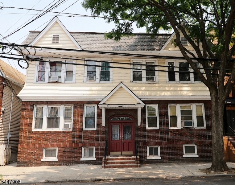 GREAT INVESTMENT OPPORTUNITY! Welcome to this well-maintained, four-family, two-story property located in the highly desirable Ironbound section of Newark. Situated on an oversized 50' x 100' lot, this income-producing property is just steps from the Ironbound's renowned restaurants, shopping, entertainment, and public transportation. The building features four spacious apartments with two- and three-bedroom layouts, each with a modern kitchen, living room, dining area, full bath, and beautiful hardwood floors throughout. Additional highlights include a partially finished basement with a laundry area, separate utilities, a brick-front exterior with aluminum siding, and two detached garages in the rear, providing valuable storage. Whether you're an investor seeking strong cash flow or an owner-occupant looking to offset your mortgage with rental income, this versatile property offers exceptional value in one of Newark's most vibrant and sought-after neighborhoods.Don't miss this rare opportunity to own a well-maintained, income-producing property in the heart of the Ironbound!