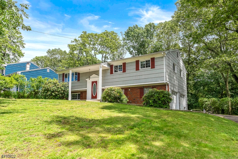 IMMACULATE! EXPANDED BILEVEL W/RENOVATED KITCHEN FEATURING A LARGE ISLAND/BREAKFAST BAR, GRANITE COUNTERS, S/S APPLIANCES, NEW SHAKER STYLE CABINETRY, ALL NEW FIXTURES, SPACIOUS ROOMS THRU-OUT. ALL 3 FULL BATHS ARE UPDATED, SLIDER ACCESS TO LARGE DECK OVERLOOKING BEAUTIFUL ALMOST 1/2 ACRE SETTING..CENTRAL A/C, H/W FLOORS, CENTRAL VAC AND MANY MORE UPDATES! LOCATED CLOSE TO TRAIN STATION, RTS 80, 206,10 & 46. AND ALL LAKE AMENITIES.   CONTINGENT ON SELLER TO FIND SUITABLE HOUSING.