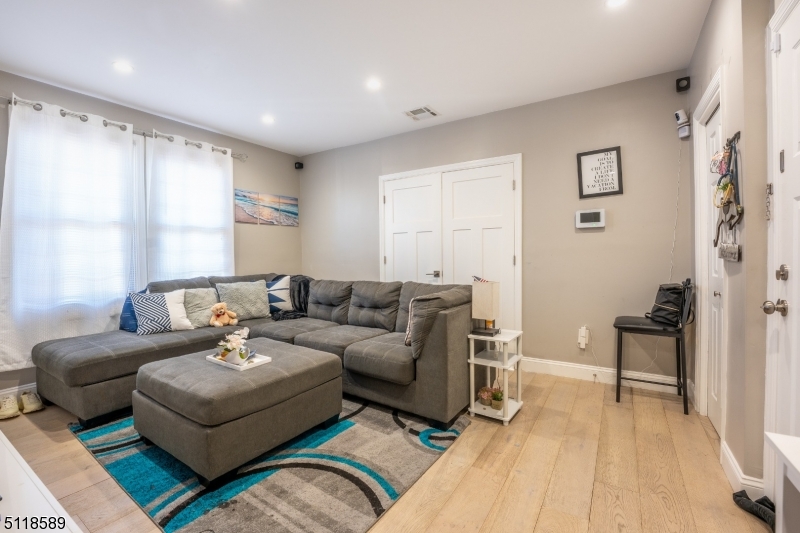 Great investment opportunity! Updated to perfection in 2017, sitting on a 6500 SF lot,  this two family awaits new owner! The first floor features a large living room, bright and airy dining room, full renovated kitchen with espresso shaker cabinets, quarts counter tops and SS appliances, all included in sale, great size bedroom and full bath. Second floor with 2 great size bedrooms, including master with walk in closet, full renovated bath with wireless Bluetooth speakers connected to the night lighting system and mosaic and porcelain tiles,  living room and eat in kitchen. Partially finished basement with full bath, and two additional rooms with endless possibilities! Full unfinished attic for possible additional living space or storage.  This home is the most energy efficient home you can ever imagine, featuring recessed lighting, tankless water heaters,  new HVAC systems and new electric (200 amp service), This gorgeous home has 7 security cameras, all newer windows, and much more! Every detail was carefully selected and quality crafted. Fabulous location, only a mile away from the train station, close to bus stops, shops and major highways. A Must See!