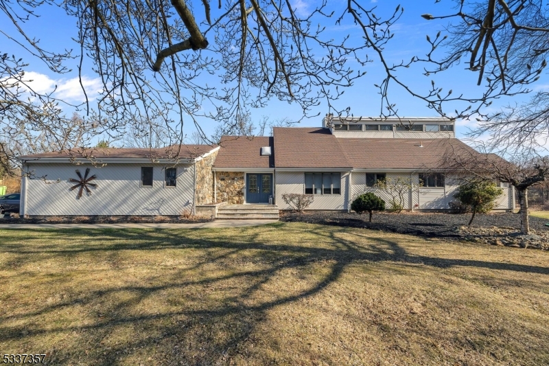 Pristine home on over 4.2 private and acres in Long Valley. Great open floor plan with an abundance of windows providing plenty of natural light & cat walk on second level overlooking the family & dining rooms . Beautifully updated kitchen with huge center island/breakfast bar, granite counters, stainless Jennair appliances and recessed lighting; spacious family room open to kitchen with full stone wall wood burning fireplace; grand living room with dual French doors to deck and warm and inviting dining room adjacent to the kitchen. Hardwood flooring on both levels, private primary suite fills the 2nd level with 2 large walk-in closets & sumptuous private bath with jetted tub & stall shower. Natural gas, 3-zone heat & central air. Generous size deck & beautiful level property for entertaining! New septic and roof in 2018, water heater in 2023. Huge unfinished basement, Long Valley Schools and West Morris Central High School with IB Program. Minutes to Rts 46 and 80.