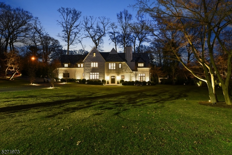 Nestled on a lovely street in the prestigious Estate section, this magnificent residence has been meticulously reimagined from the ground up. With a reverential nod to its historic charm and grace, every detail of this enchanting home and property has been thoughtfully modernized and elevated to the highest standards. A bright entry foyer leads to a sunken living room with exposed, original beams and restored wood-burning fireplace. Sunroom off living room has heated floors and doors that lead out to the garden. Office with built-ins is on this level, as well as open-concept kitchen and dining area. In the kitchen there are 2 dishwashers flanking the sink, an 8-burner dual-oven Wolf range, Sub-Zero fridge, custom appliance cabinet, doors that open up to the garden, and don't miss the hidden pantry! A fabulous powder room and mudroom (accessible from the garage), with tons of storage, complete this level. Ascend the grand staircase to the stunning 2nd floor landing where you will find the primary bedroom with ensuite to the right and 3 additional bedrooms, all with their own exquisite ensuite bathrooms. Full laundry room also on this floor. Third floor houses an additional bedroom, full bath and den. Finally, head down to the lower level where you will find the perfect media room for watching movies, a powder room, a wine room with seating, and more storage. French drains on lower level.