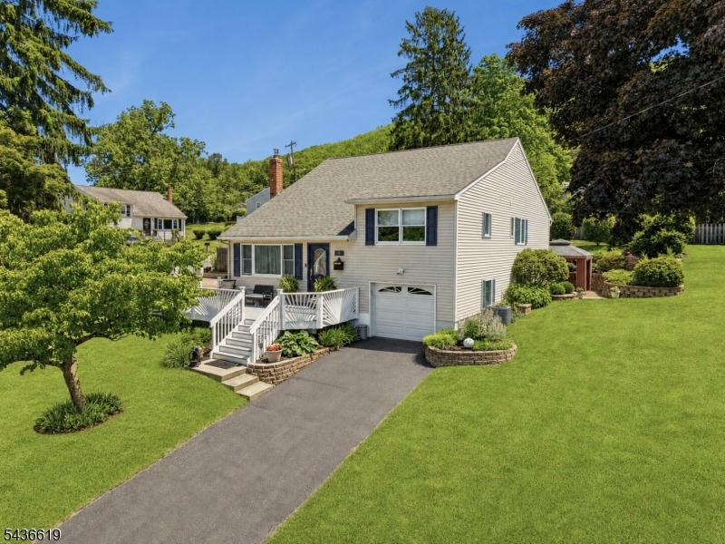 Set high in Ogdensburg's desirable Presidential Section, this impeccably maintained 3BR, 3BA home offers mountain views & breathtaking sunsets! Thoughtfully improved and cared for to exacting standards by long-time owners, this exceptional home showcases resort-style outdoor living with expansive deck, outdoor kitchen/bar, gazebo entertainment area, firepit retreat, paver patios & beautifully terraced landscaping designed for entertaining or peaceful enjoyment. Flexible layout offers possible mother/daughter living with first-floor bedroom & en suite. Expansive primary retreat features radiant heated floors, spa-like bath, office & deck access. Anderson windows, 5-zone heat, whole-house generator, new above-ground indoor oil tank, heated garage & finished basement provide comfort & peace of mind. Security cameras/audio recording devices in use.